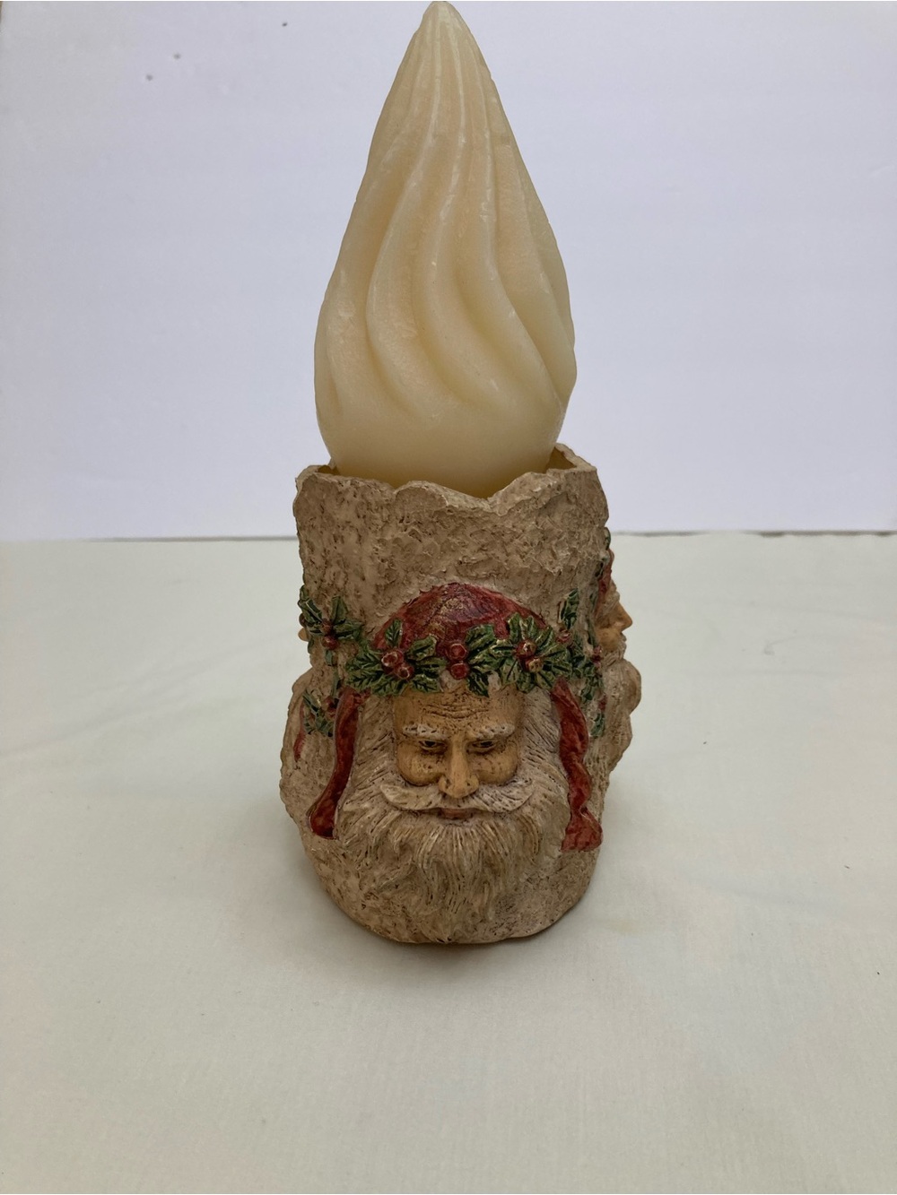 Holiday Santa Candle Holder - Swirl Candle Red, green on tan background.